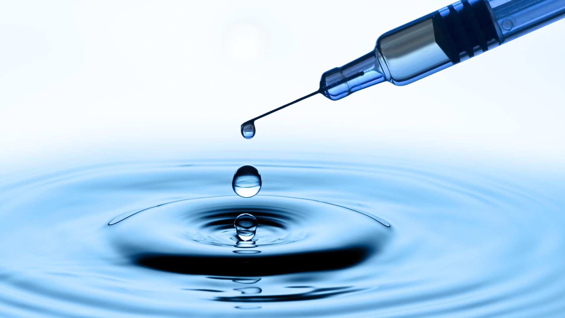 From micro-cooling to medicine: How nanofluids behave near thin needles